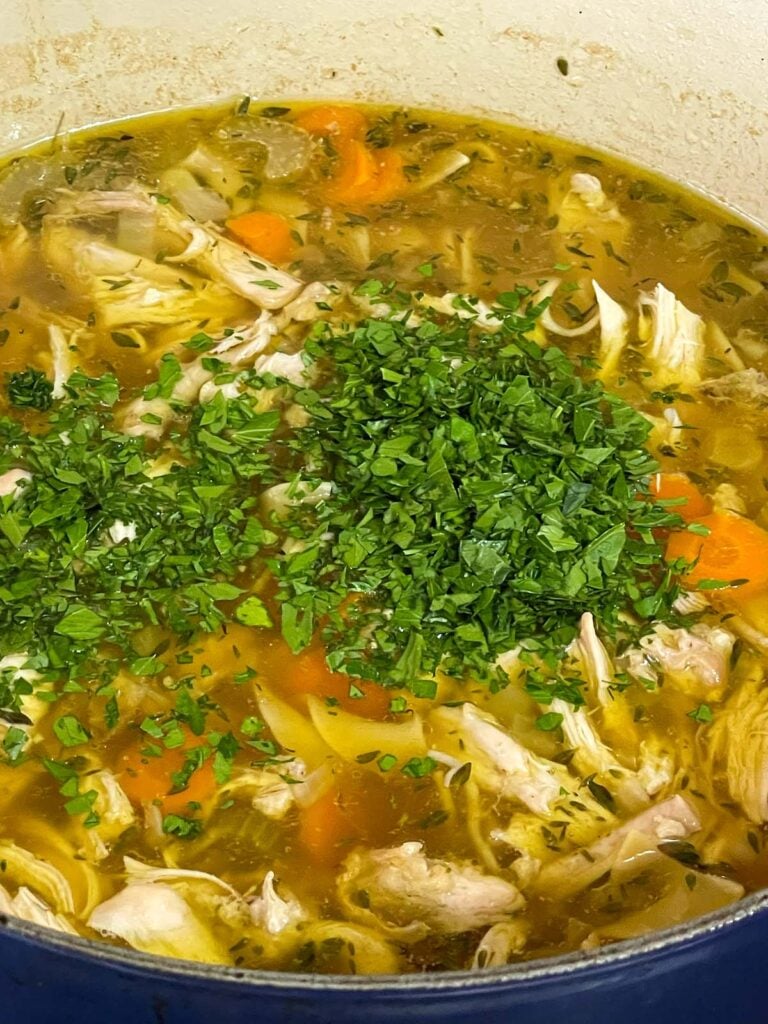Parsley added to the chicken noodle soup.