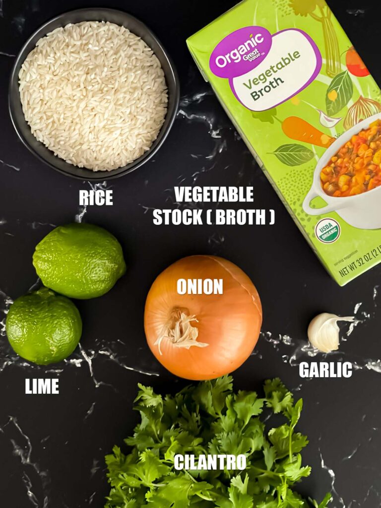 Cilantro lime rice recipe ingredients on a dark surface.