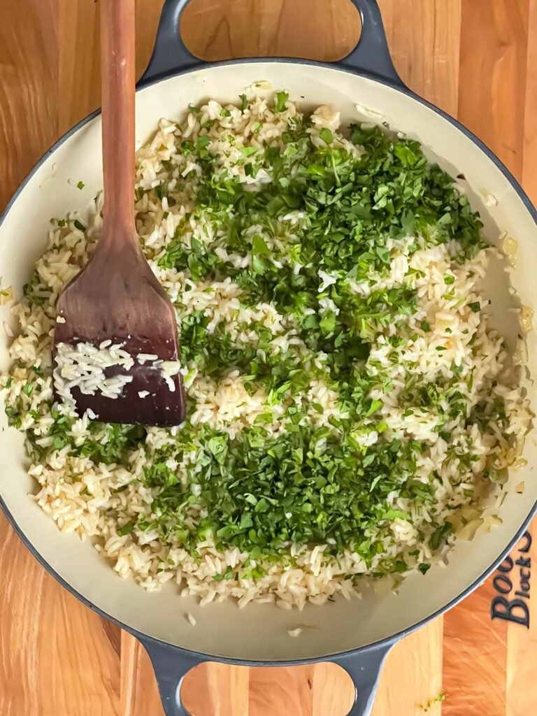 Lime zest, fresh lime juice, and cilantro added to the cooked rice.