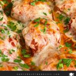 Easy baked parmesan meatballs garnished with chopped Italian flat leaf parsley.