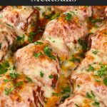 Easy baked parmesan meatballs garnished with chopped Italian flat leaf parsley.