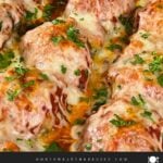Easy baked parmesan meatballs garnished with chopped Italian flat leaf parsley.