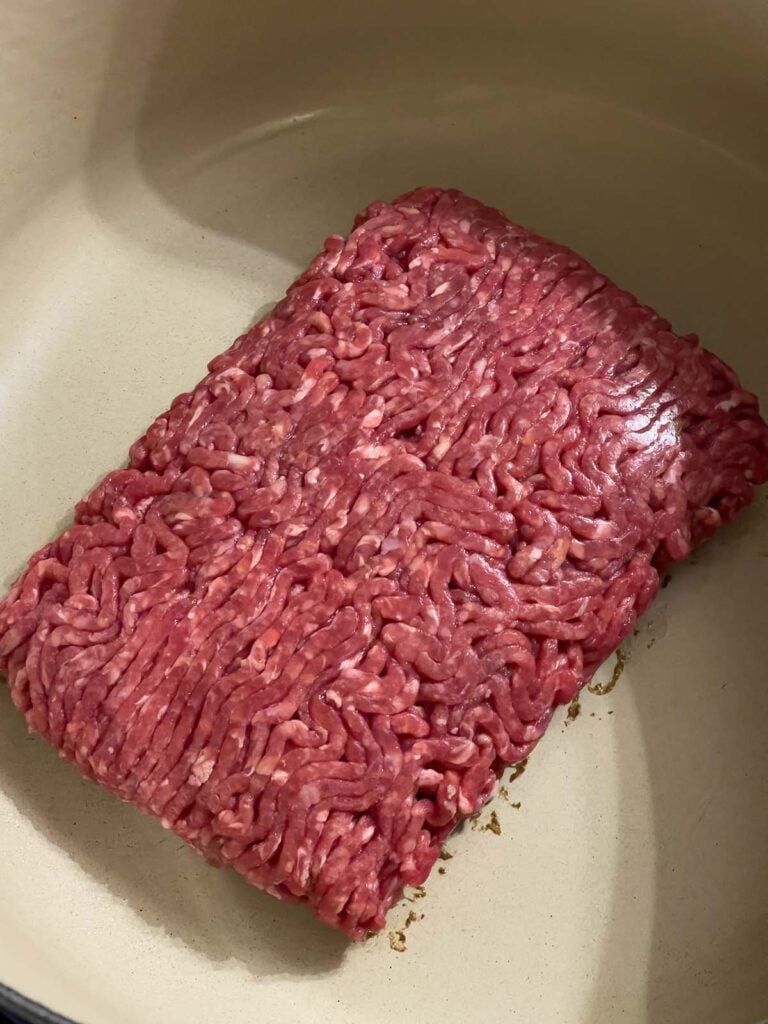 Ground beef in a dutch oven.