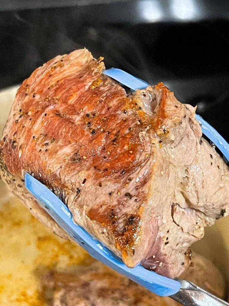 A piece of browned pork shoulder.