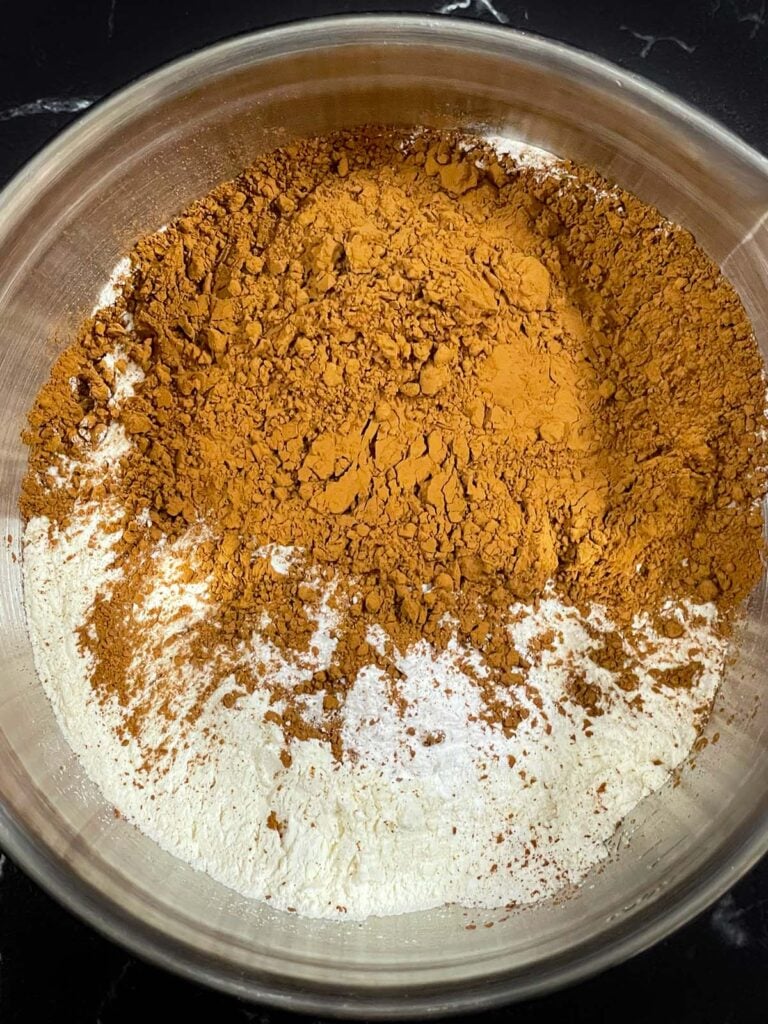 Chocolate peppermint biscotti recipe dry ingredients in a metal bowl.