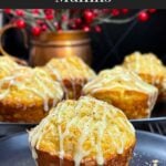 Eggnog muffins on a dark plate.