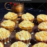 Eggnog muffins on a dark wooden board.