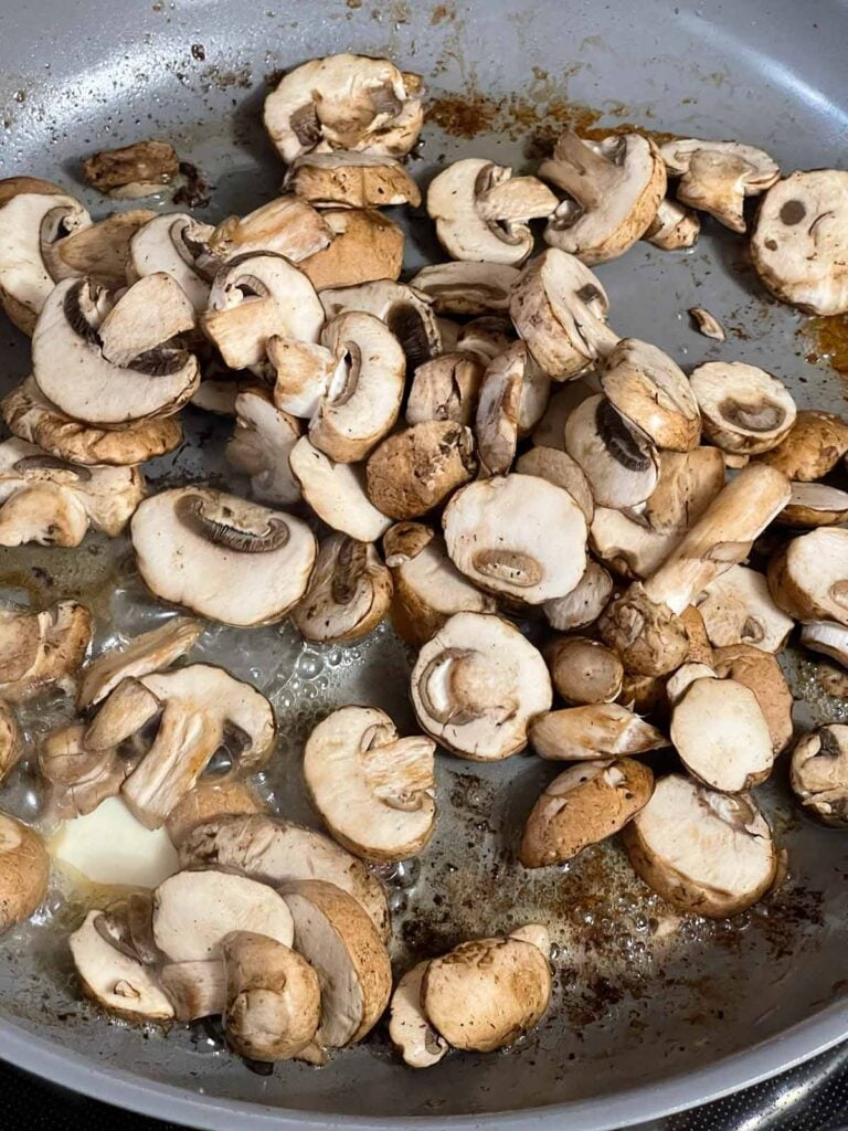 Mushrooms added to the skillet after removing Salisbury steak patties