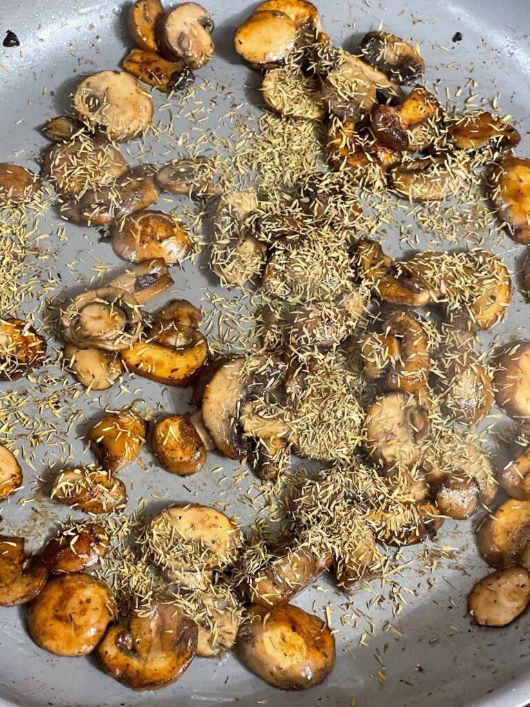 Herbs added to mushrooms while making mushroom gravy for Salisbury steak