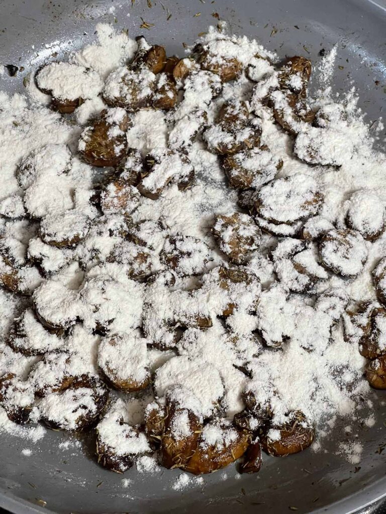 Flour added to mushrooms to thicken gravy for Salisbury steak