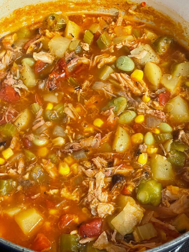 Brunswick stew cooking in a dutch oven.
