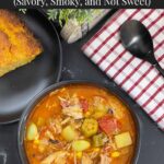 Brunswick Stew in a dark bowl with cornbread in the background.