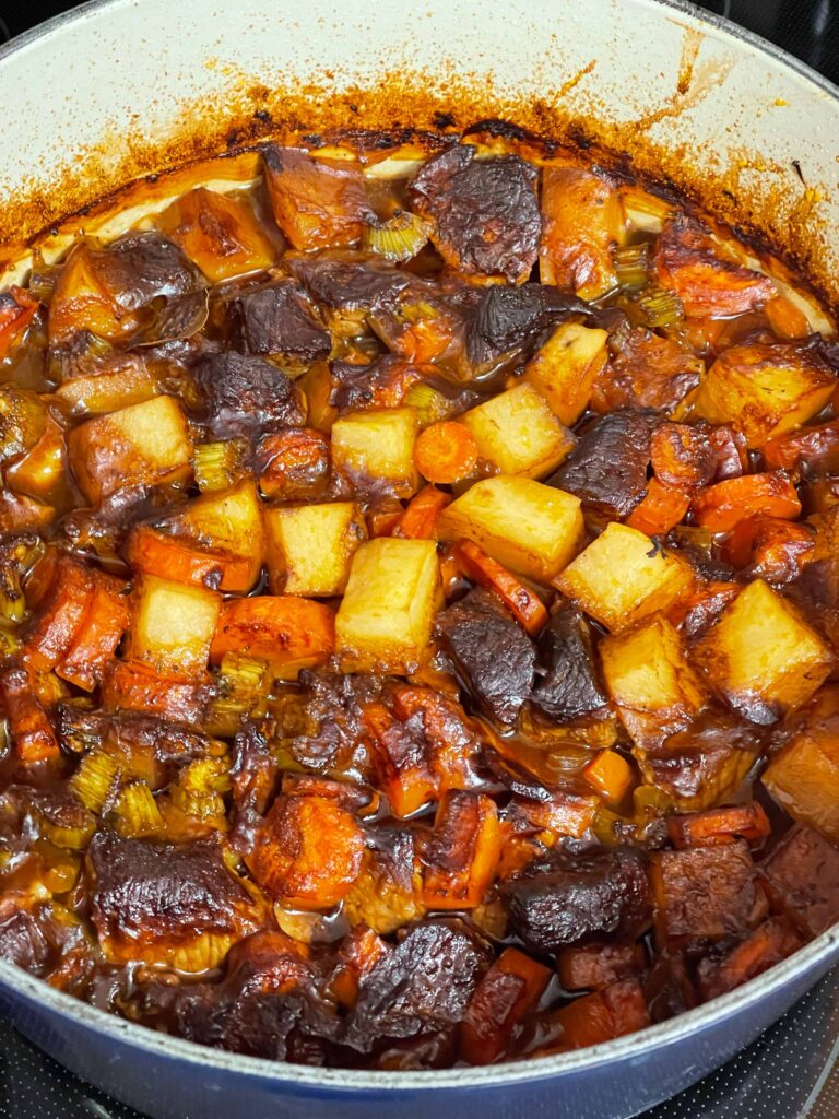 Irish stew cooked in a dutch oven.