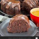 A slice of chocolate Kahlúa cake on a dark plate.