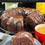 A slice of chocolate Kahlúa cake on a dark plate.