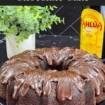 Chocolate Kahlúa cake on a dark platter.