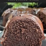 A slice of chocolate Kahlúa cake on a dark plate.