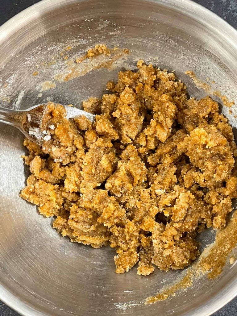 Streusel ingredients for sweet potato coffee cake mixed in a metal bowl.