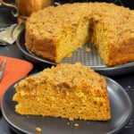 A slice of sweet potato coffee cake on a dark plate.