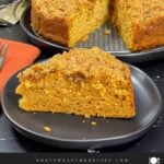 A slice of sweet potato coffee cake on a dark plate.