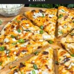 A buffalo chicken pizza on a cutting board.