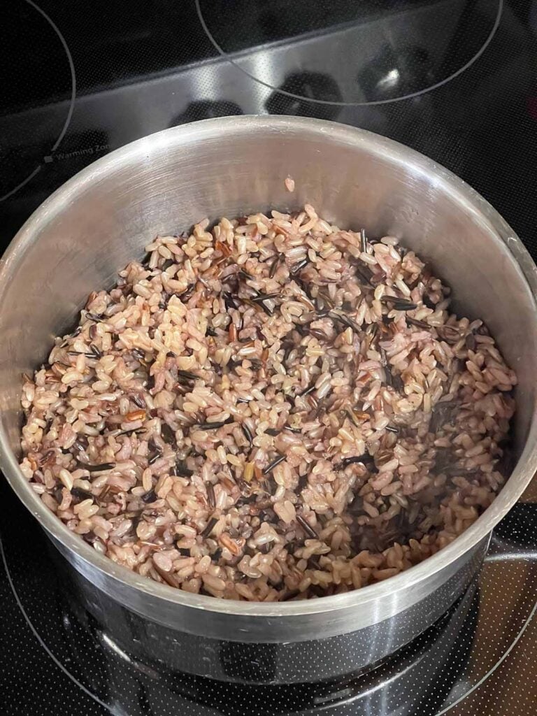 Cooked wild rice in a pot.