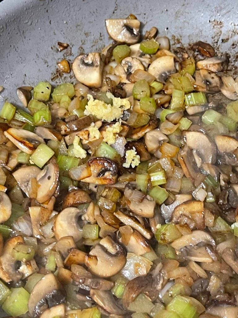 Cooked vegetables in a skillet.