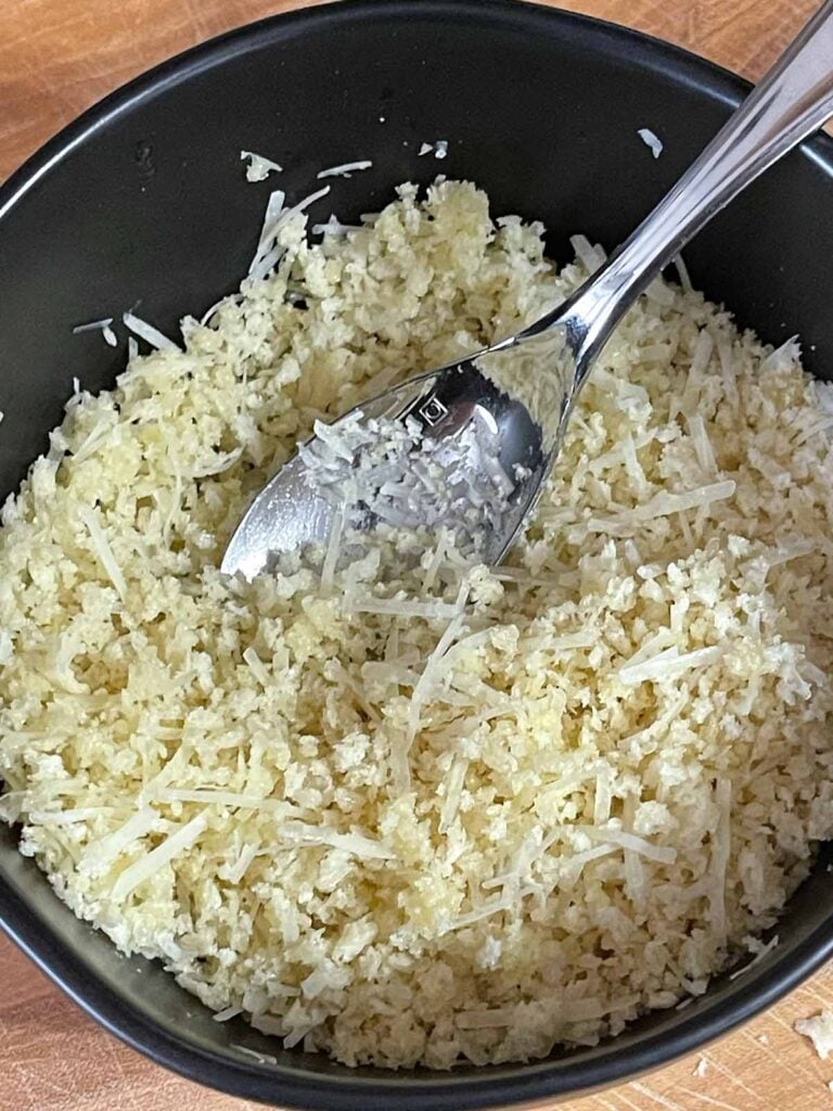 Panko breadcrumb mixture in a dark bowl.