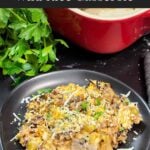 Chicken and wild rice casserole on a dark plate.