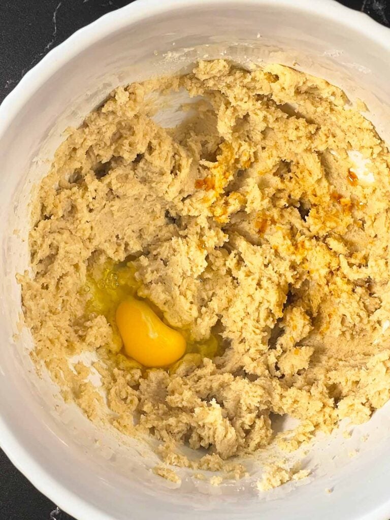 Vanilla extract and one egg added to the creamed butter and sugars.