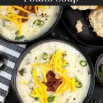 Creamy potato soup topped with diced bacon, shredded cheddar cheese, and diced green onions in dark bowls.