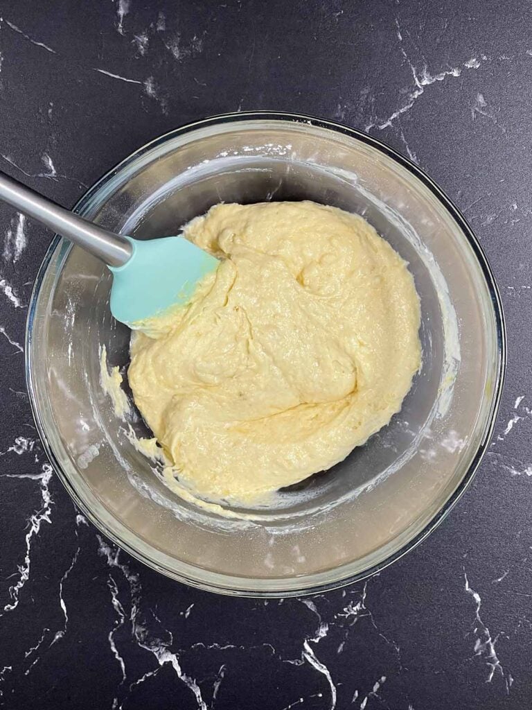 Banana pancake batter with buttermilk, egg yolks, and melted butter mixed together.
