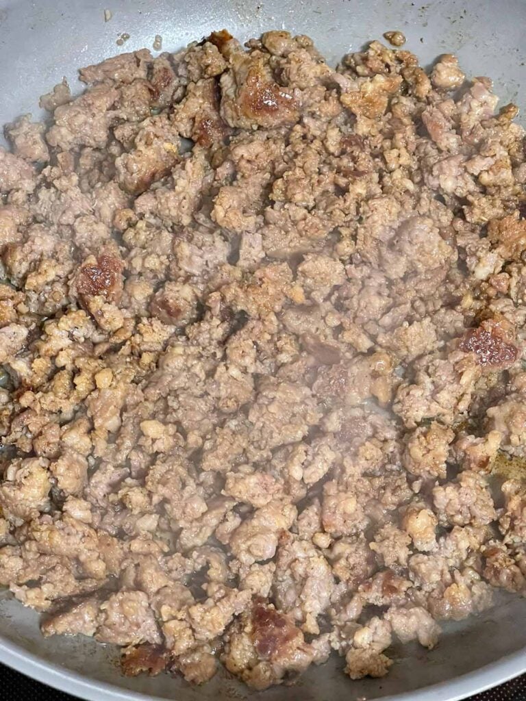 Cooked breakfast sausage in a skillet.