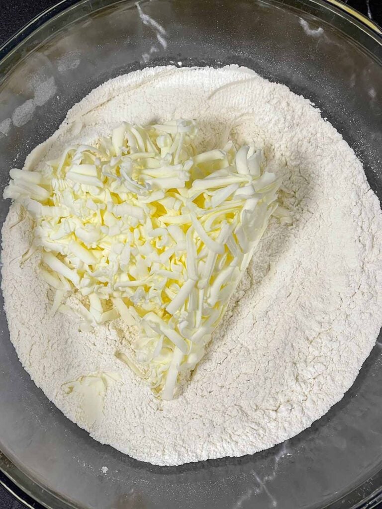 Frozen, shredded butter added to dry ingredients for biscuits.