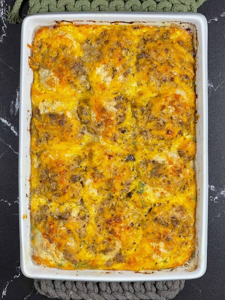 Biscuits and gravy breakfast casserole right out of the oven in a 9x13 baking dish.