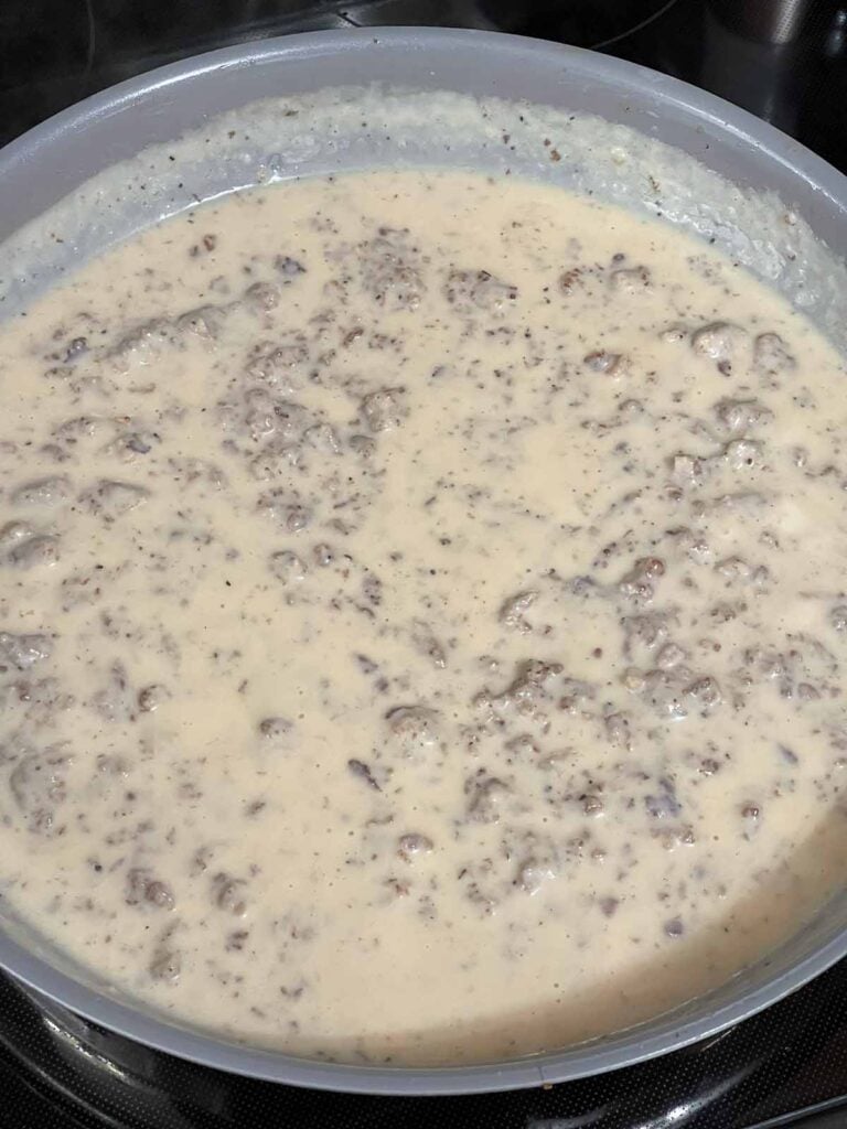 Sausage gravy in a skillet.