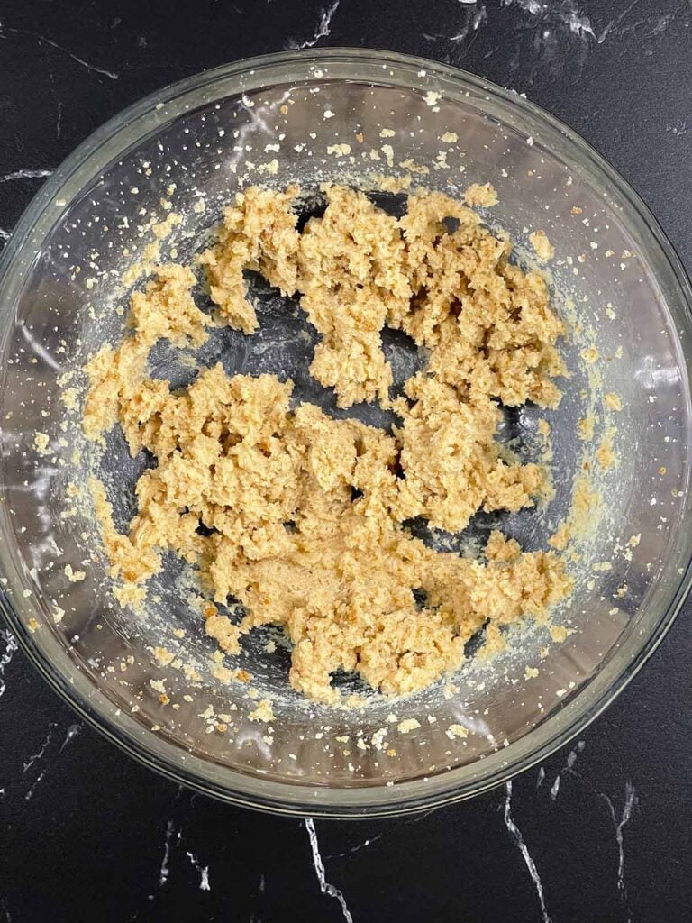 Bowl of creamed butter, granulated sugar, and brown sugar mixed until light and fluffy.