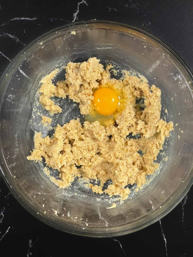 An egg and coconut extract added to the creamed butter and sugars.