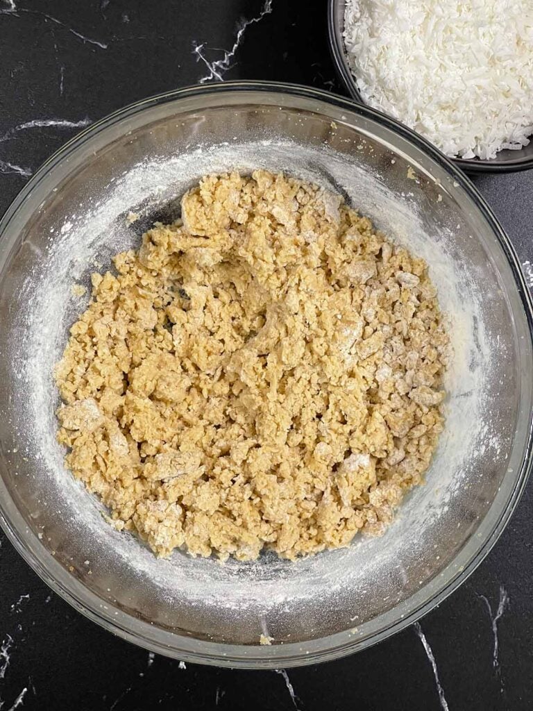 Cookie dough fully mixed and smooth before adding shredded coconut.