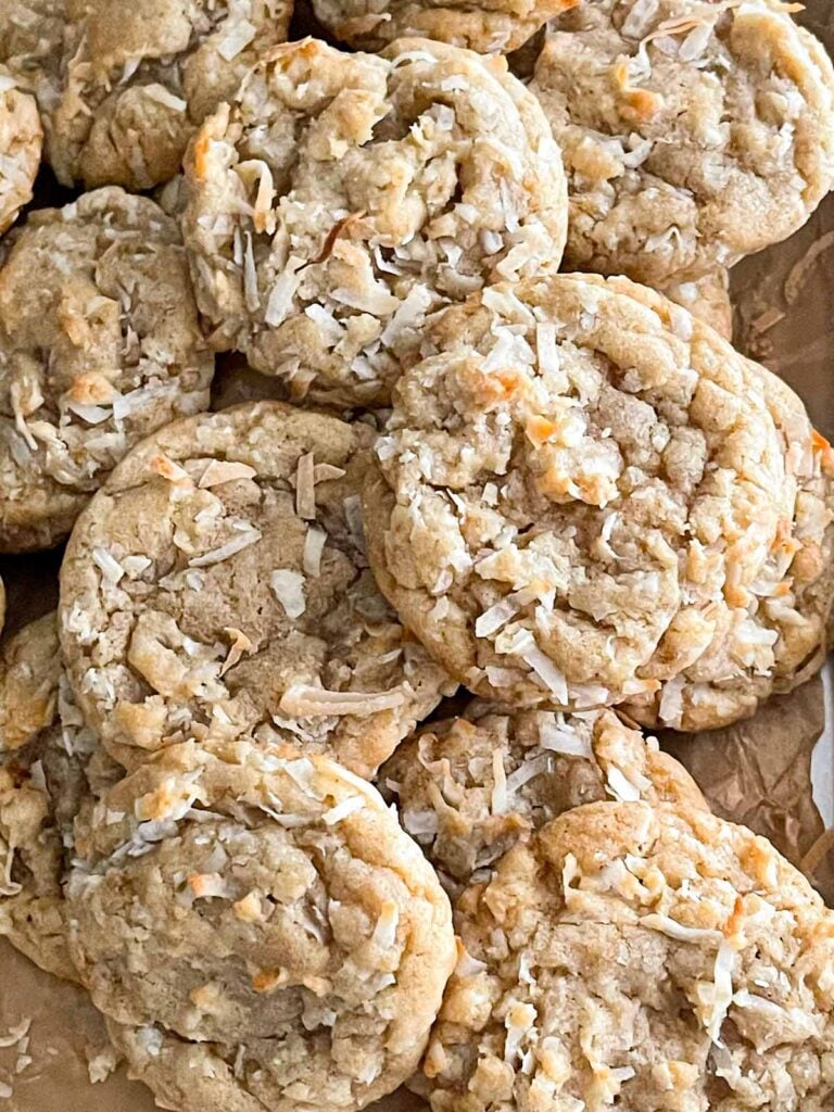 Close-up of soft and chewy coconut cookies showing tender center and coconut texture.