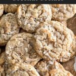 Soft and chewy coconut cookies stacked on parchment paper.