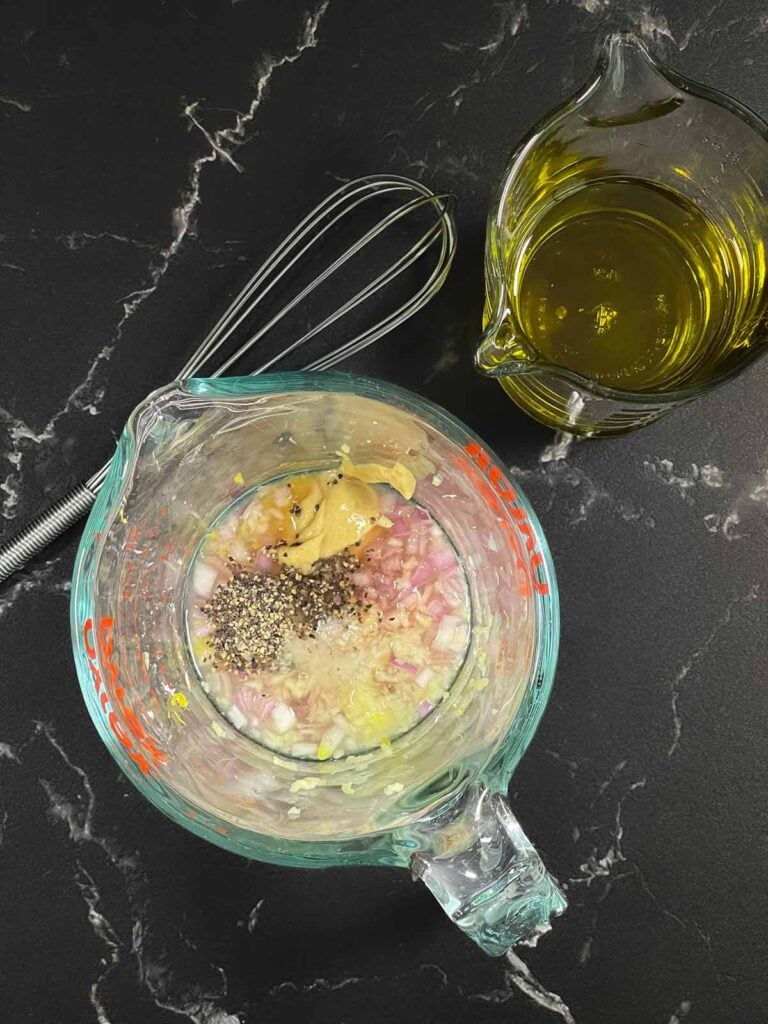 Preparing vinaigrette for no mayo potato salad.