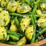 Close up of green bean potato salad with fresh dill.