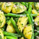 Green bean potato salad with lemon dill vinaigrette in a wooden bowl.