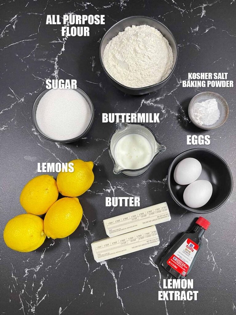 Ingredients for lemon crumb muffins including flour, sugar, eggs, butter, buttermilk, fresh lemons and lemon extract.