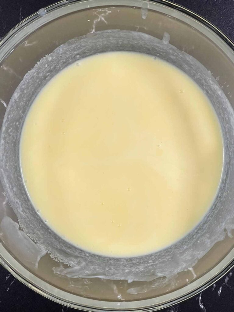 Wet ingredients whisked together until well combined for lemon crumb muffins.