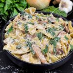 Spinach and Mushroom Pasta in a dark bowl.