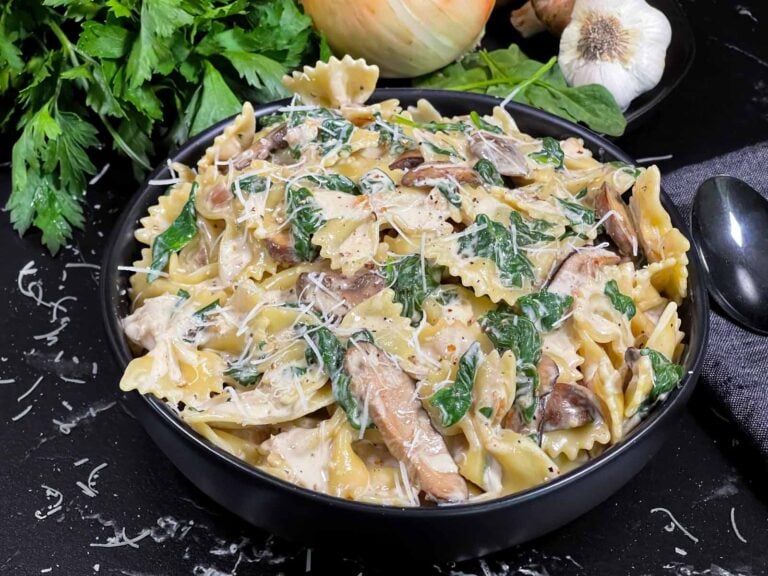 Spinach and Mushroom Pasta in a dark bowl.
