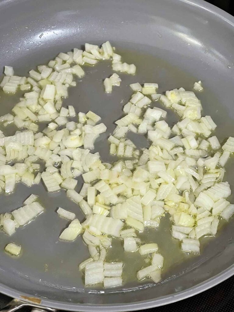 Onions and olive oil together in a skillet.