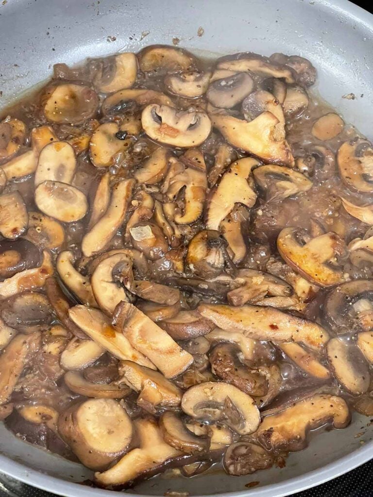 Mushrooms cooked in a skillet.